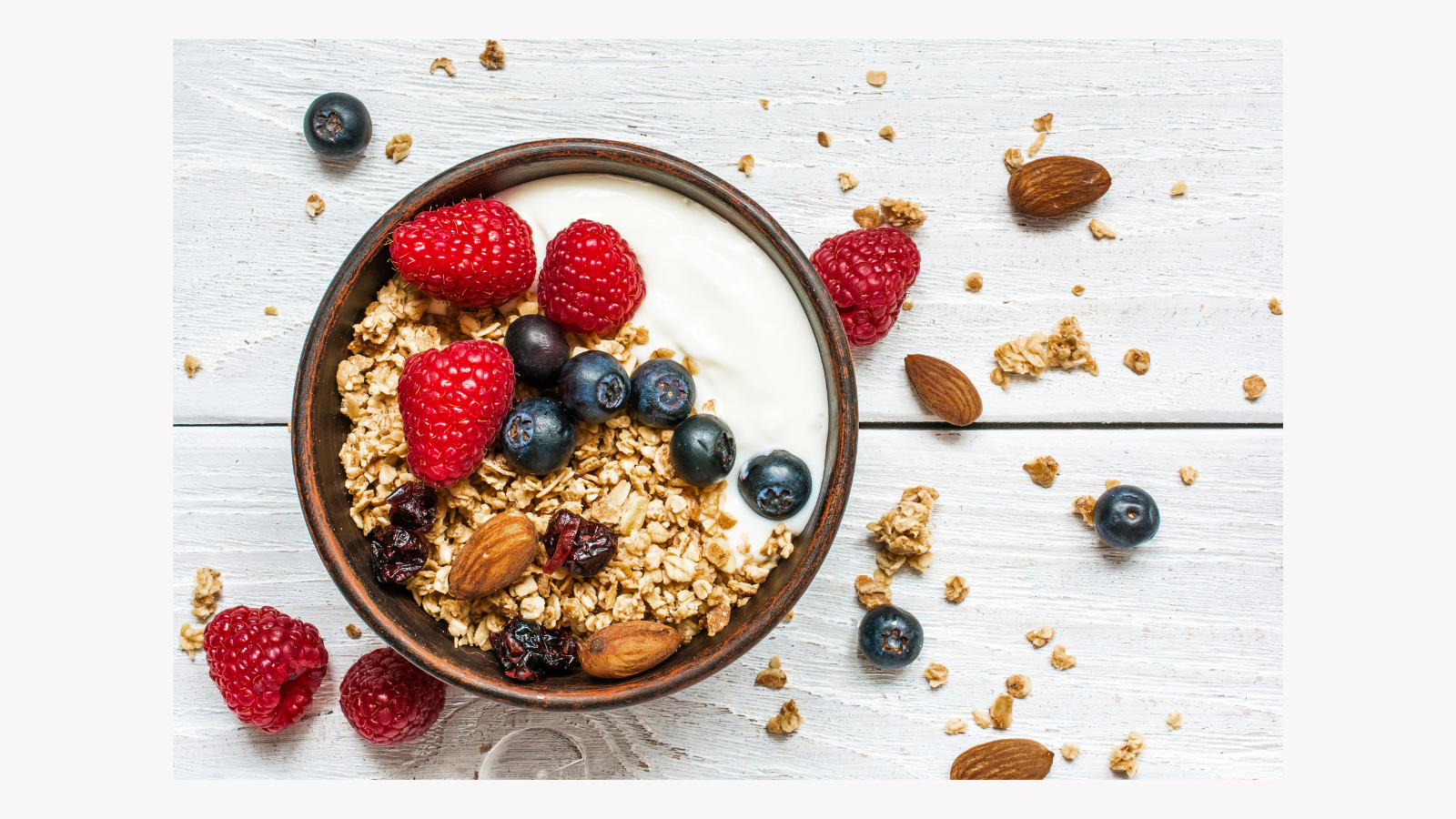 Bowl of yogurt, berries and granola for a healthy meal on a vegetarian diet eating plan.  Good for diabetics, people with diabetes or prediabetes, high blood pressure or obesity